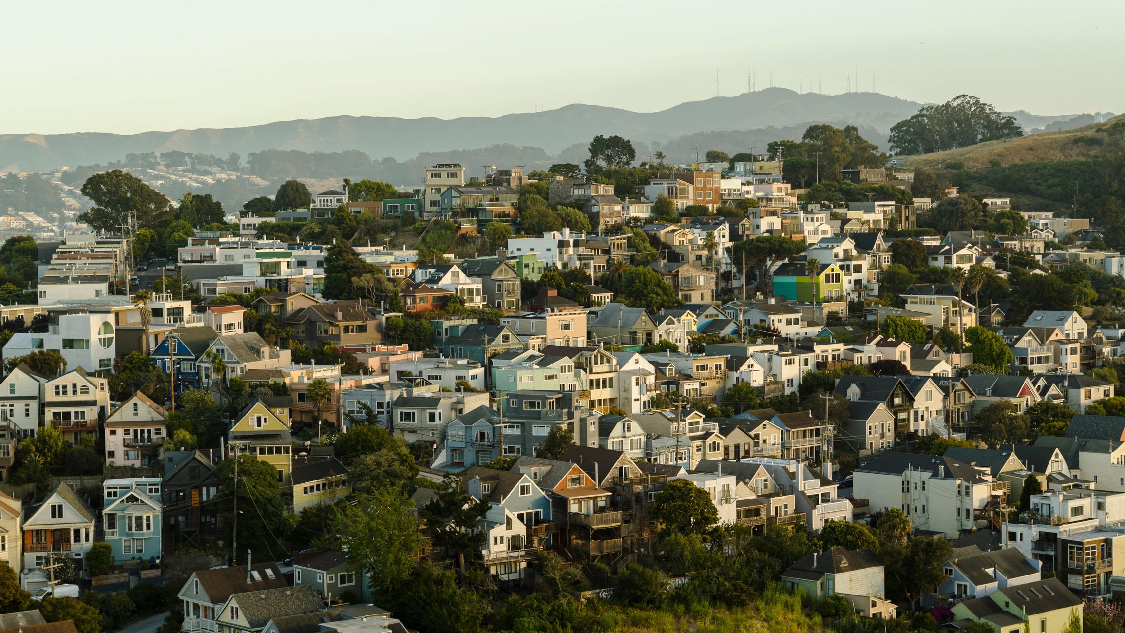 Hillside neighborhood with homes and mountain views