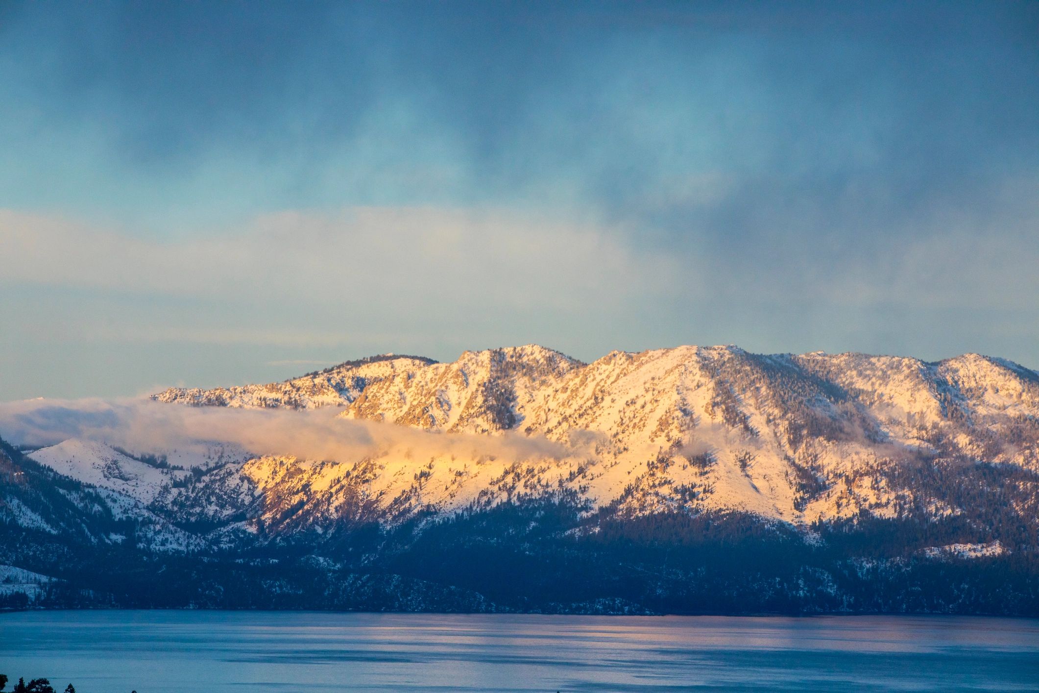 Lake Tahoe mountain and water view at sunset
