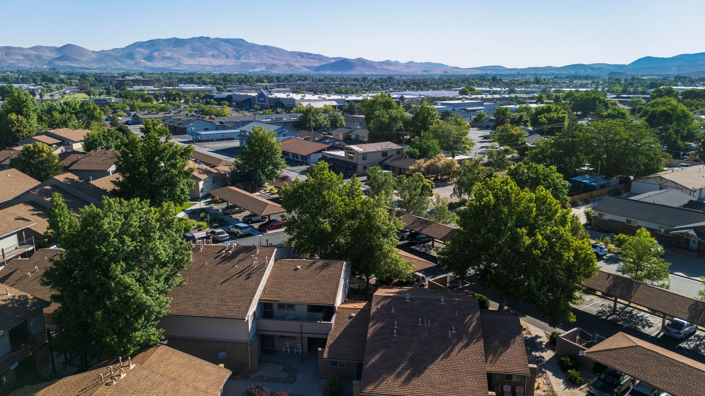 Aerial view of a Northern Nevada residential neighborhood with mountains in the background